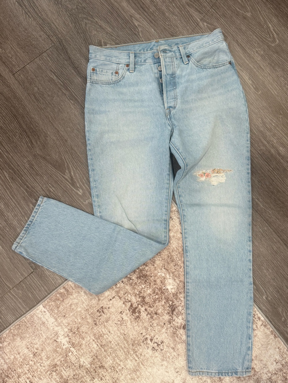 Levi's Light Blue Straight Leg Jeans with Subtle Distress